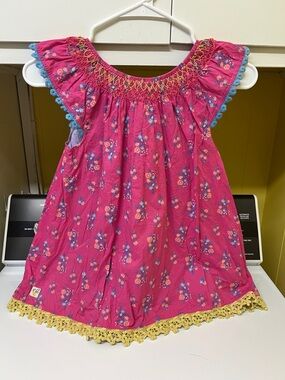 Angel sleeve top with crochet trim and smocked neck line